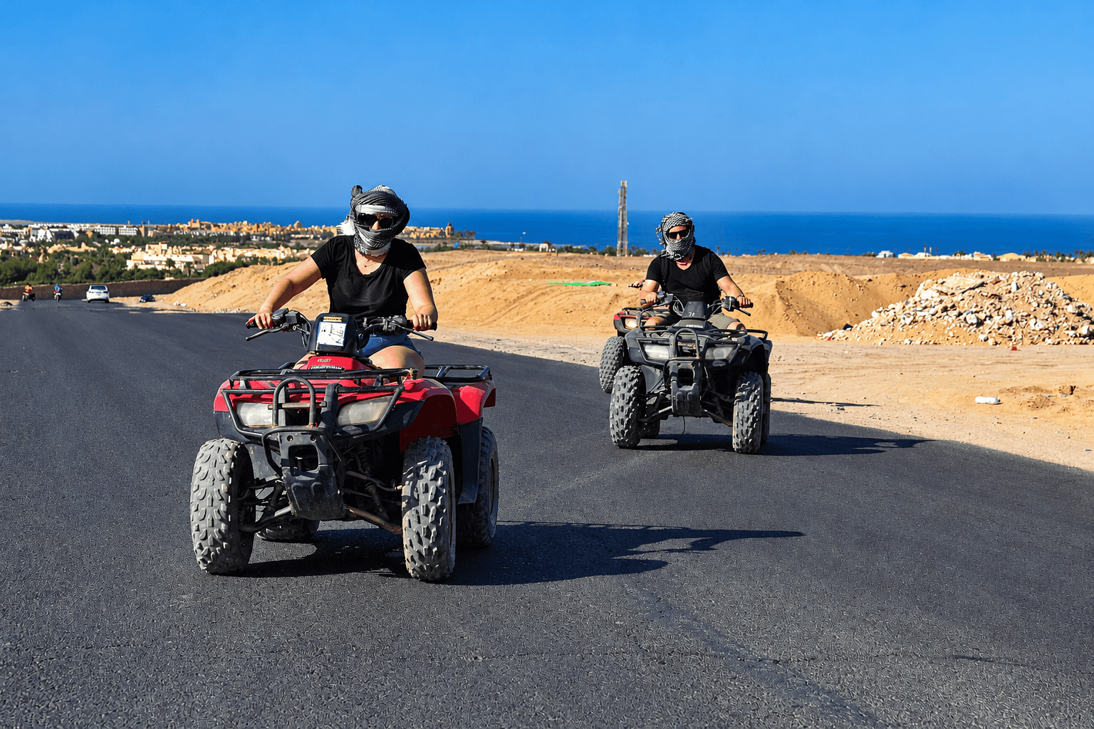 Two quad-bike riders on a desert route in Hurghada